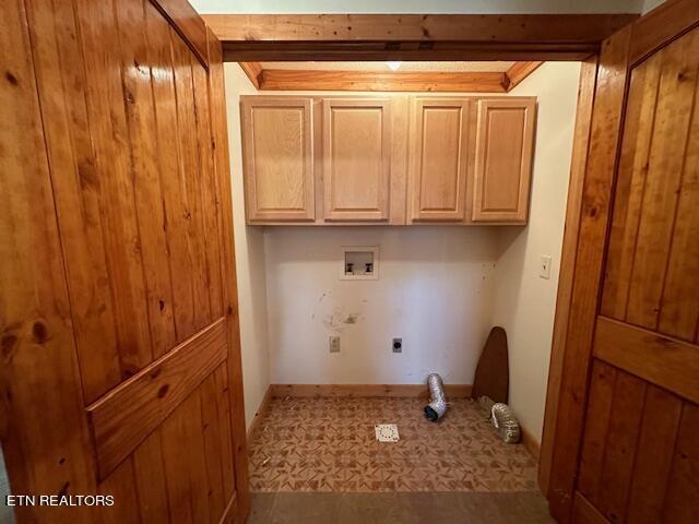 washroom featuring hookup for a washing machine, cabinets, and electric dryer hookup