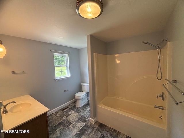 full bathroom featuring vanity, bathtub / shower combination, and toilet