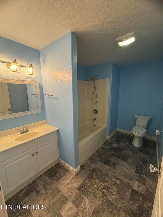 full bathroom with washtub / shower combination, a textured ceiling, vanity, and toilet