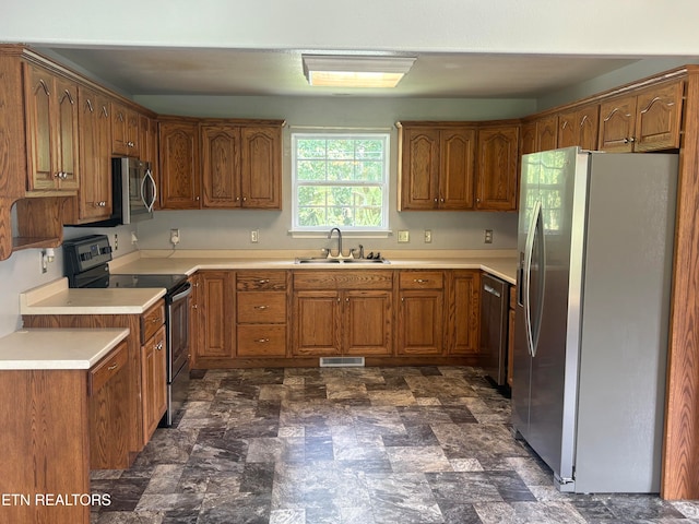 kitchen featuring appliances with stainless steel finishes and sink