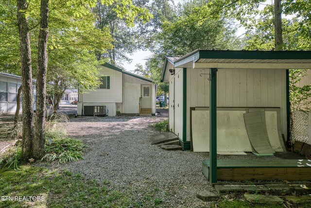 view of outbuilding featuring central air condition unit