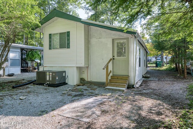 back of house featuring central AC