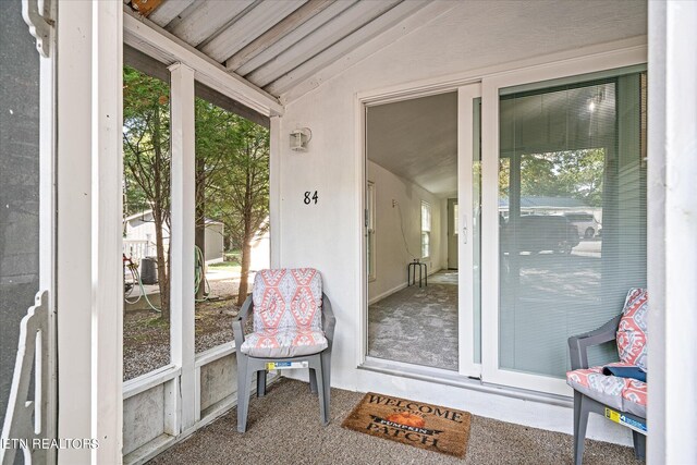 sunroom / solarium with vaulted ceiling