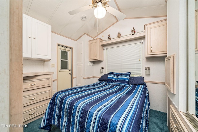 carpeted bedroom featuring ceiling fan and vaulted ceiling