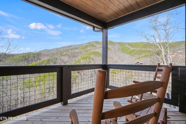 wooden terrace featuring a mountain view