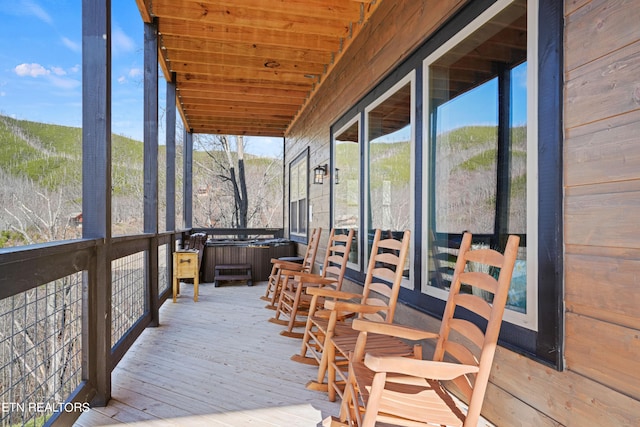 sunroom / solarium featuring plenty of natural light