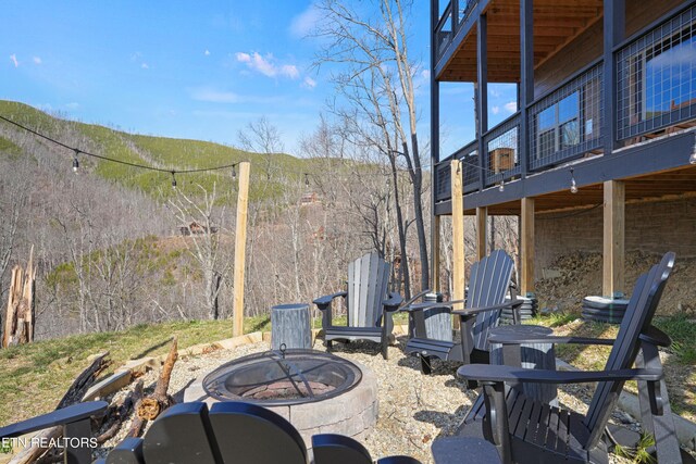 view of patio featuring an outdoor fire pit