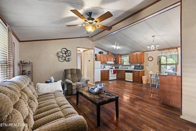 living room featuring dark hardwood / wood-style floors, ceiling fan with notable chandelier, vaulted ceiling, a textured ceiling, and crown molding