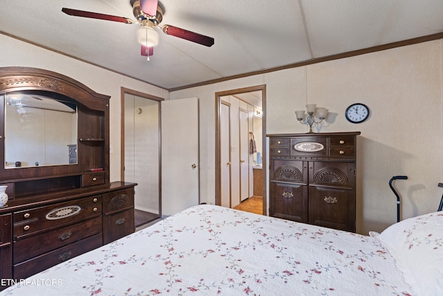 bedroom featuring ceiling fan, wood-type flooring, and a textured ceiling