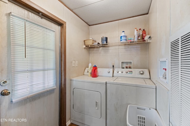 washroom featuring washer and dryer