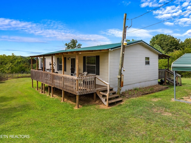 back of property featuring a lawn