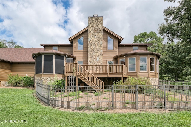 view of front of property with a front lawn and a deck