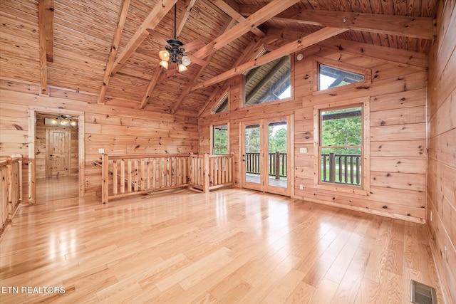 additional living space featuring wood ceiling, light hardwood / wood-style flooring, and wood walls