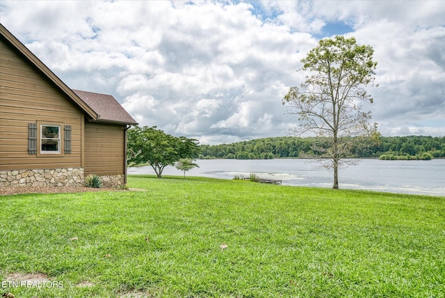 view of yard with a water view