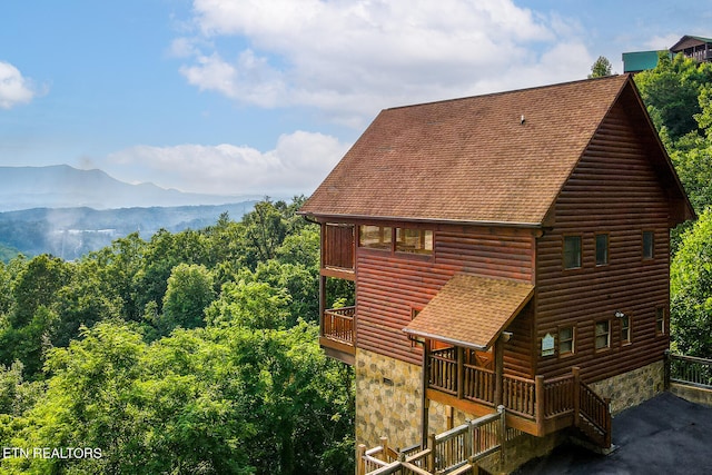 view of home's exterior featuring a mountain view