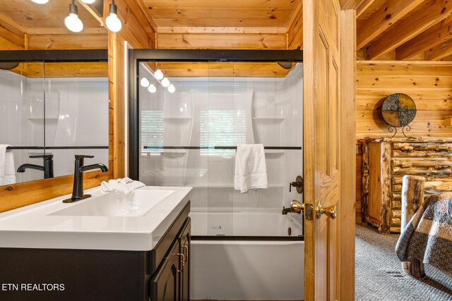 bathroom with wood ceiling, vanity, and enclosed tub / shower combo