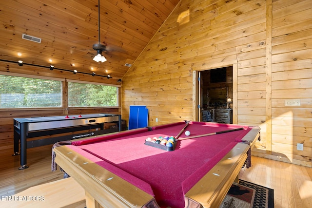 recreation room featuring hardwood / wood-style floors, pool table, vaulted ceiling, and wooden walls