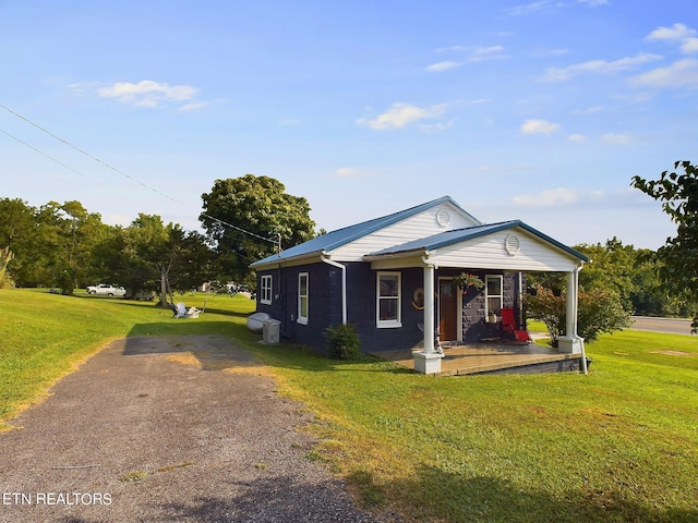 view of front facade with a porch and a front yard