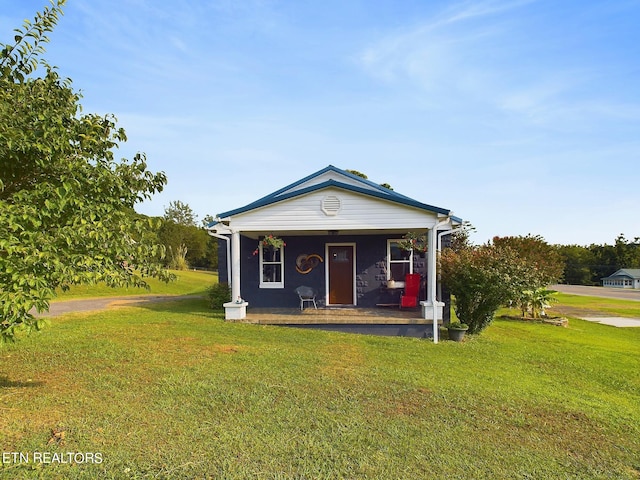 view of front of property with a porch and a front yard