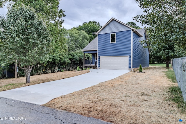 view of side of home with a garage