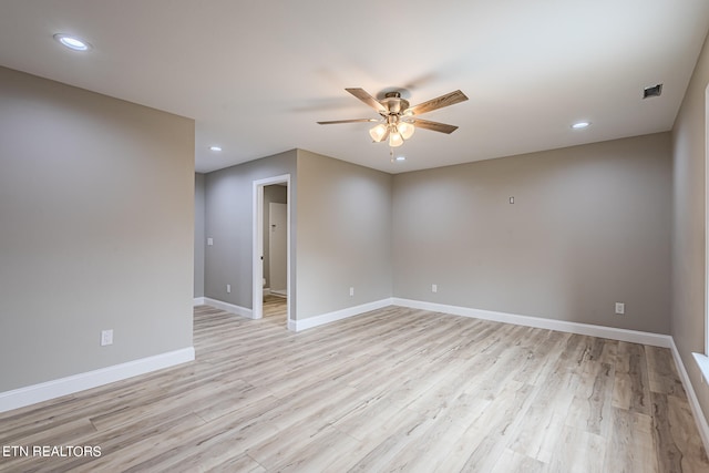 unfurnished room with recessed lighting, a ceiling fan, baseboards, and light wood finished floors