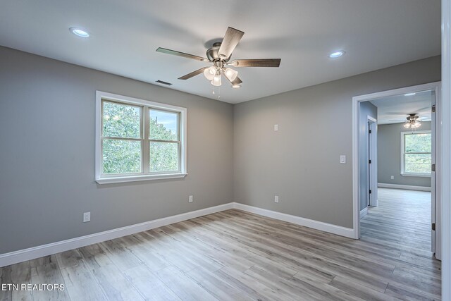 unfurnished room featuring ceiling fan and light hardwood / wood-style flooring