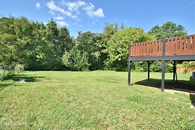 view of yard with a wooden deck