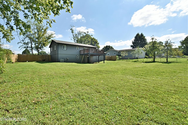 view of yard with a wooden deck