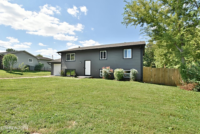 back of property featuring a yard