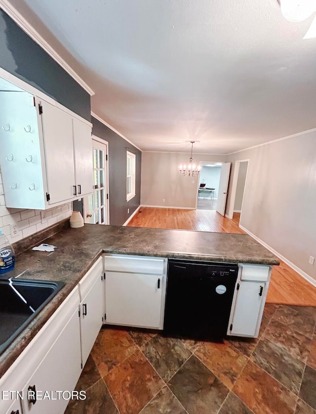 kitchen featuring black dishwasher, a chandelier, white cabinets, and kitchen peninsula