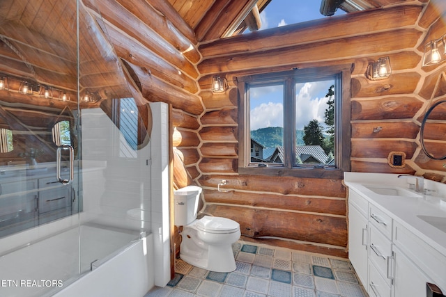 full bathroom featuring rustic walls, toilet, vanity, and tile patterned floors