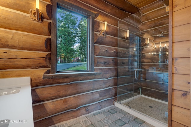 bathroom featuring an enclosed shower, tile patterned floors, and vanity