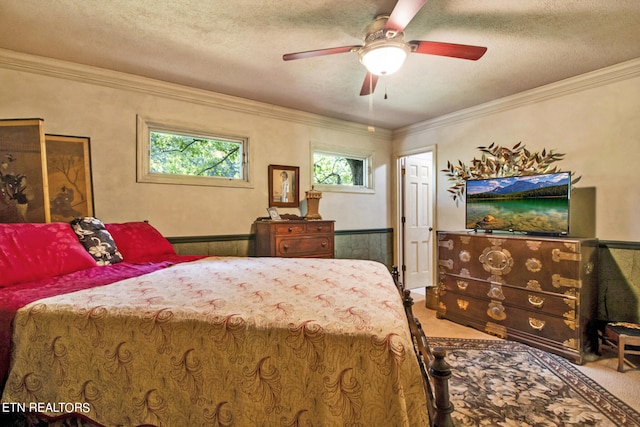 bedroom with carpet, ornamental molding, and a textured ceiling