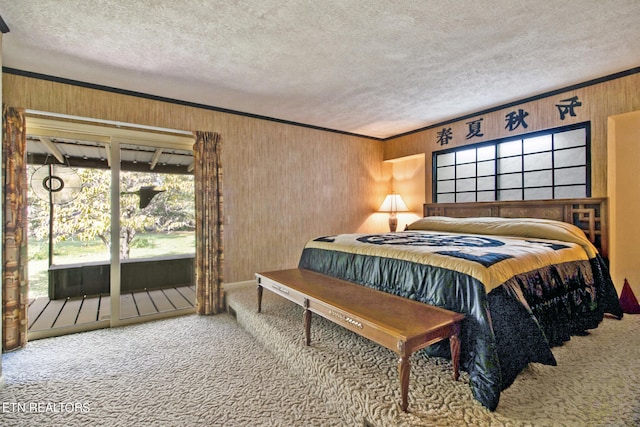 bedroom with access to outside, carpet floors, a textured ceiling, and ornamental molding