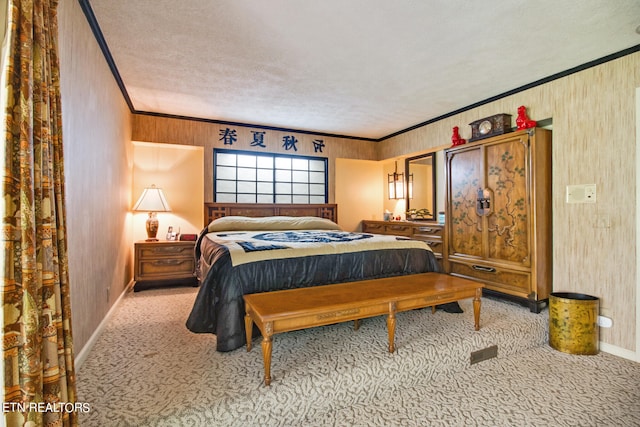 carpeted bedroom featuring a textured ceiling and ornamental molding