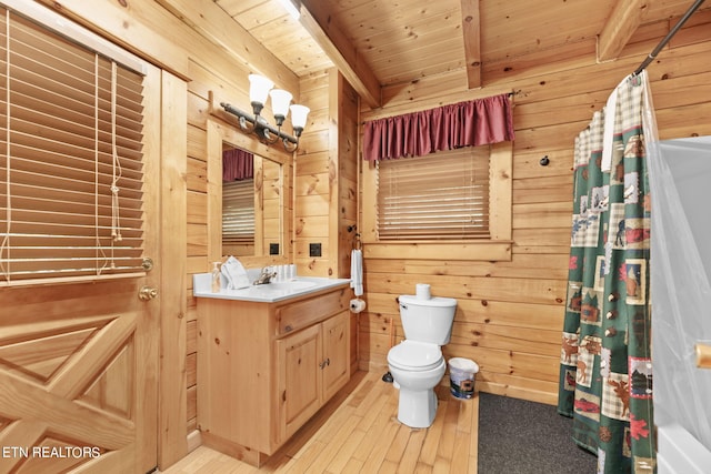 full bathroom with vanity, wooden walls, wood-type flooring, wood ceiling, and toilet