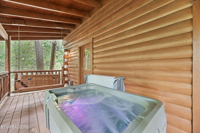 deck with a hot tub