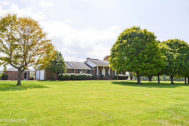 view of yard featuring a garage