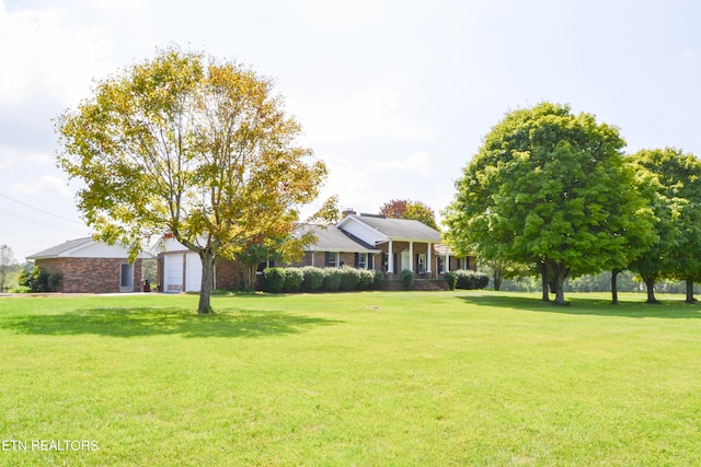 view of yard with a garage