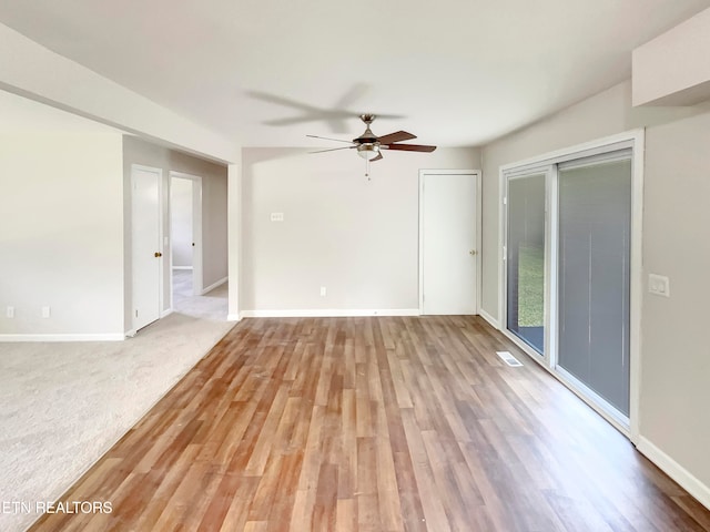 interior space featuring carpet floors and ceiling fan