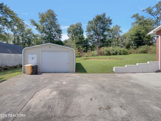 garage with a lawn