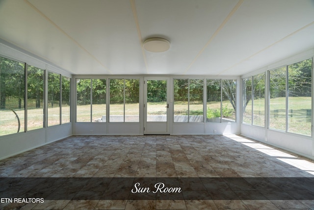 unfurnished sunroom with a healthy amount of sunlight