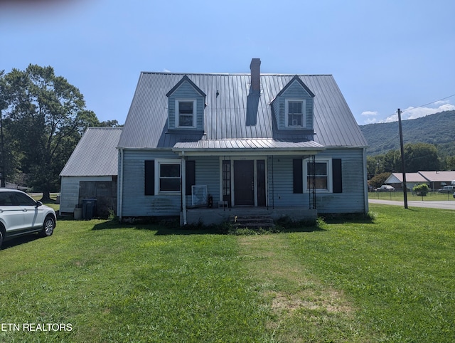 view of front of home with a front lawn and covered porch