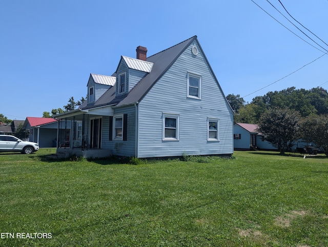 view of home's exterior with a lawn