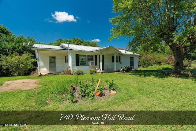 ranch-style house with a front lawn and cooling unit