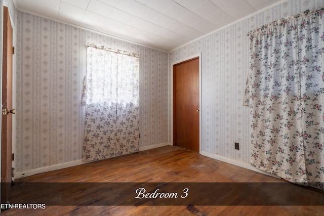 spare room with hardwood / wood-style flooring