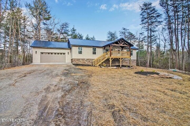 view of front of property with a deck and a garage