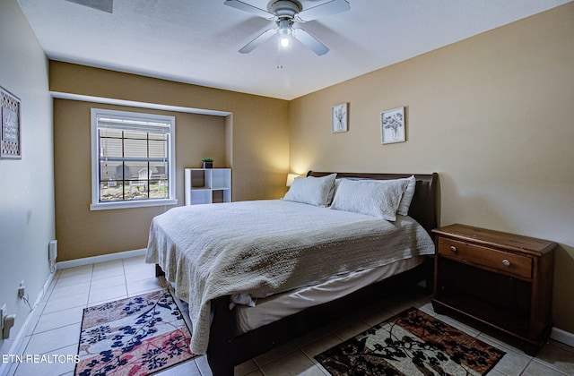 tiled bedroom with ceiling fan