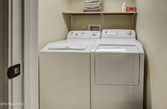 laundry room featuring separate washer and dryer