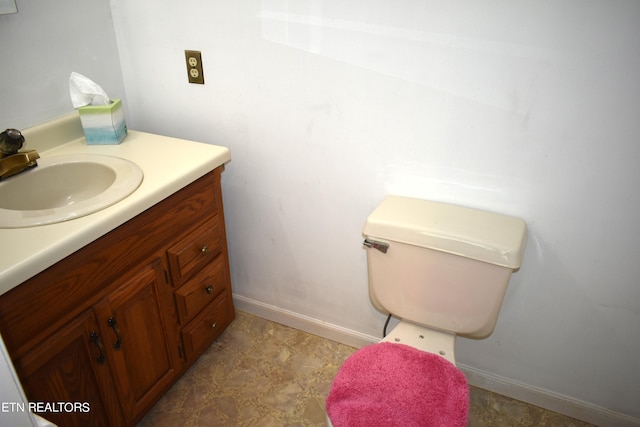 bathroom with baseboards and vanity